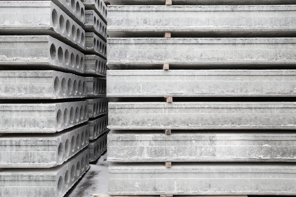 Stack,Of,Prefabricated,Concrete,Slabs,With,Hole,For,Construction.