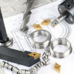 Lathe,Tool,,Drill,And,Workpiece,Laid,On,The,Blueprint