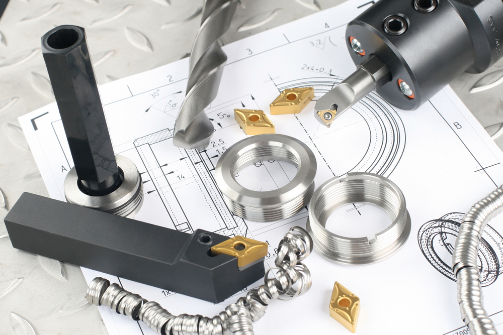 Lathe,Tool,,Drill,And,Workpiece,Laid,On,The,Blueprint